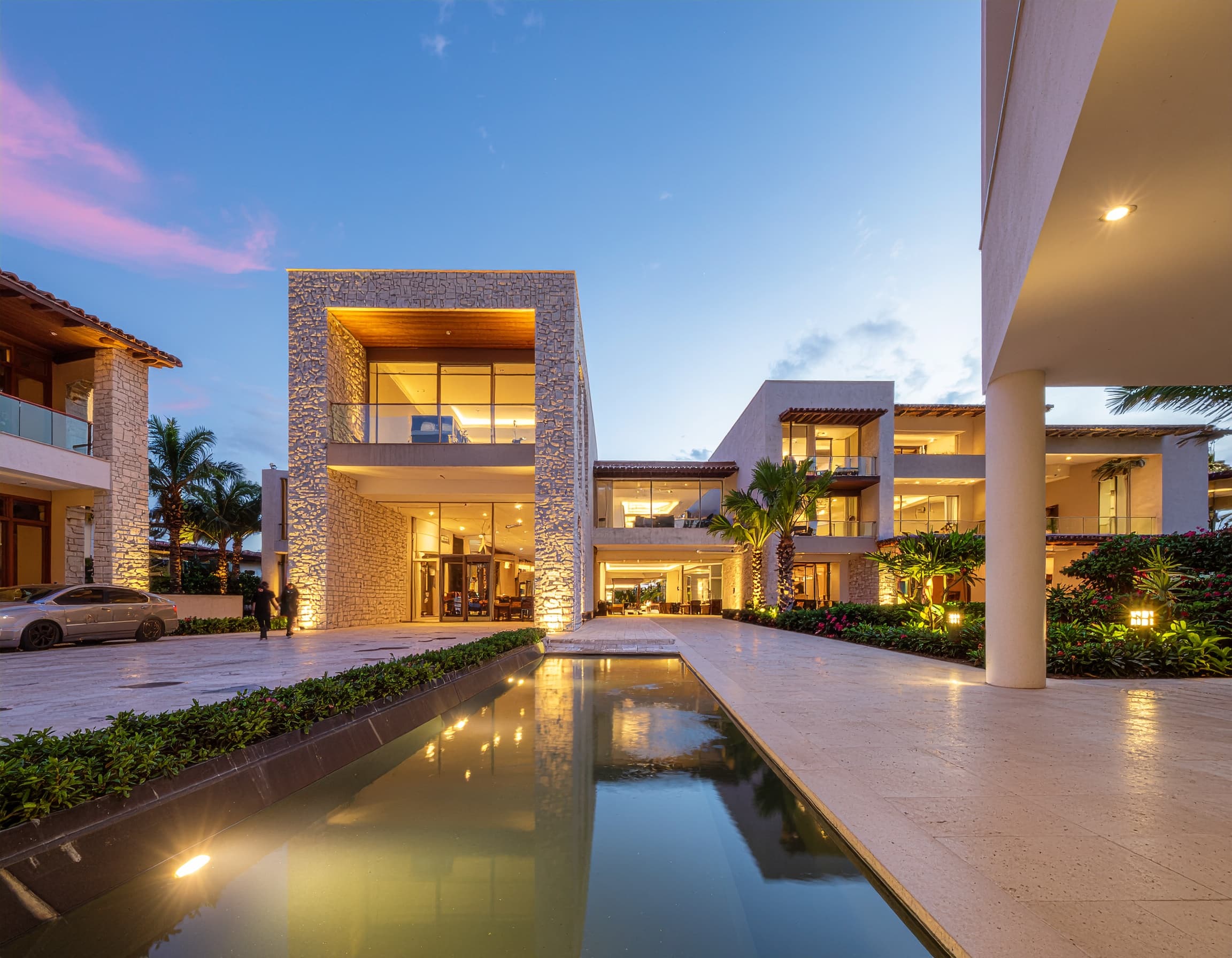 Modern boutique hotel exterior at sunset
